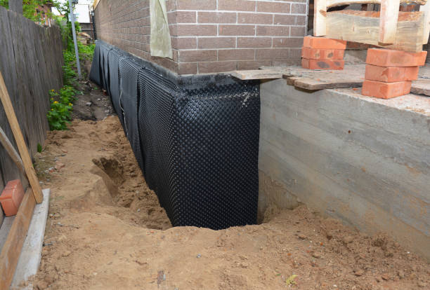 Happy homeowners after waterproofing job in Gillette